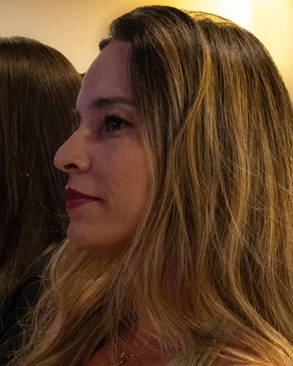 Participante de perfil, atenta à palestra no BPE 2026
