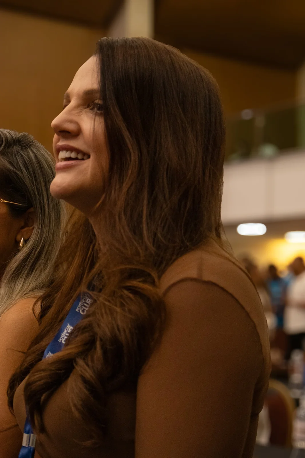 Participante sorrindo durante a palestra no BPE 2026